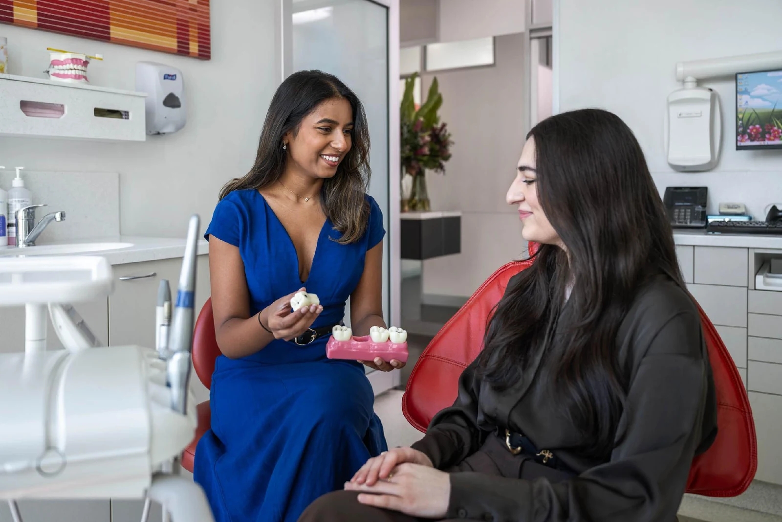 Dr Shania Paranavithana with a patient in the treatment room