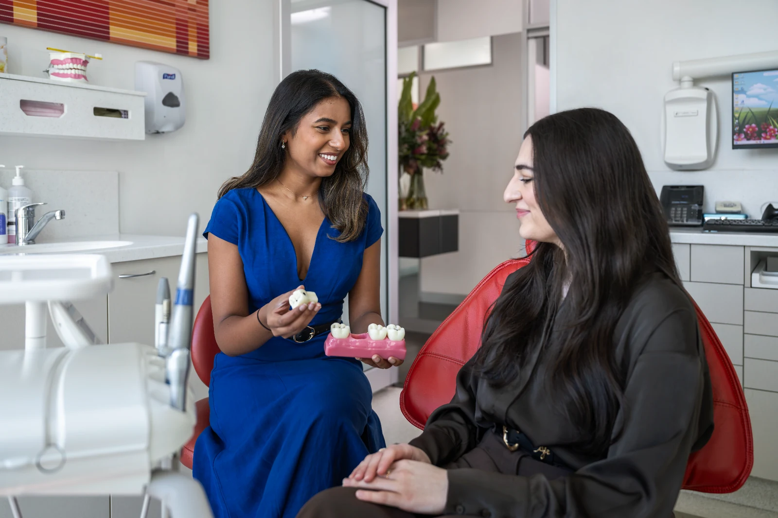 Dr Shania Paranavithana welcoming a patient in the treatment room
