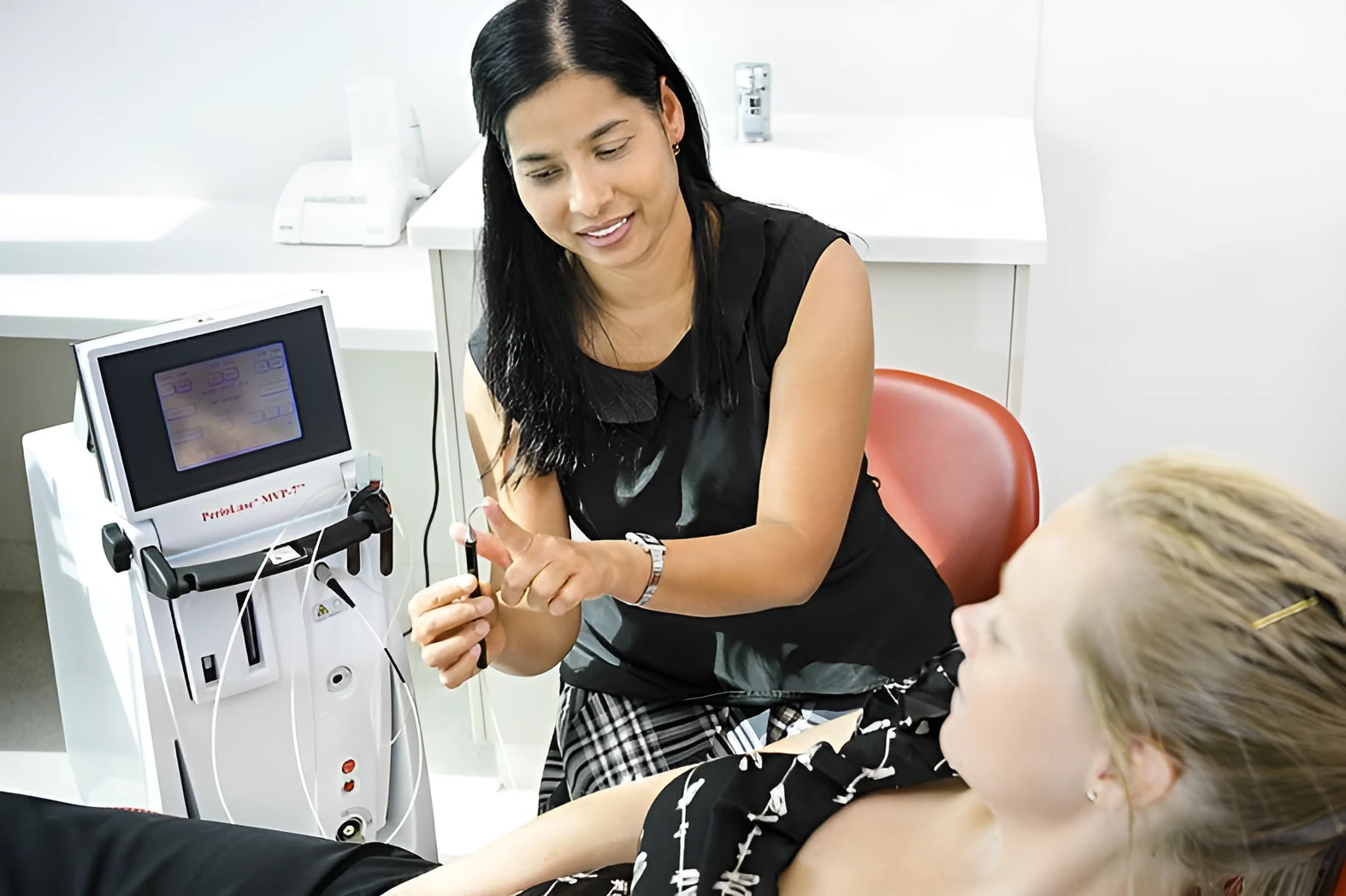 Dr Renu Karn explaining LANAP laser treatment to a patient